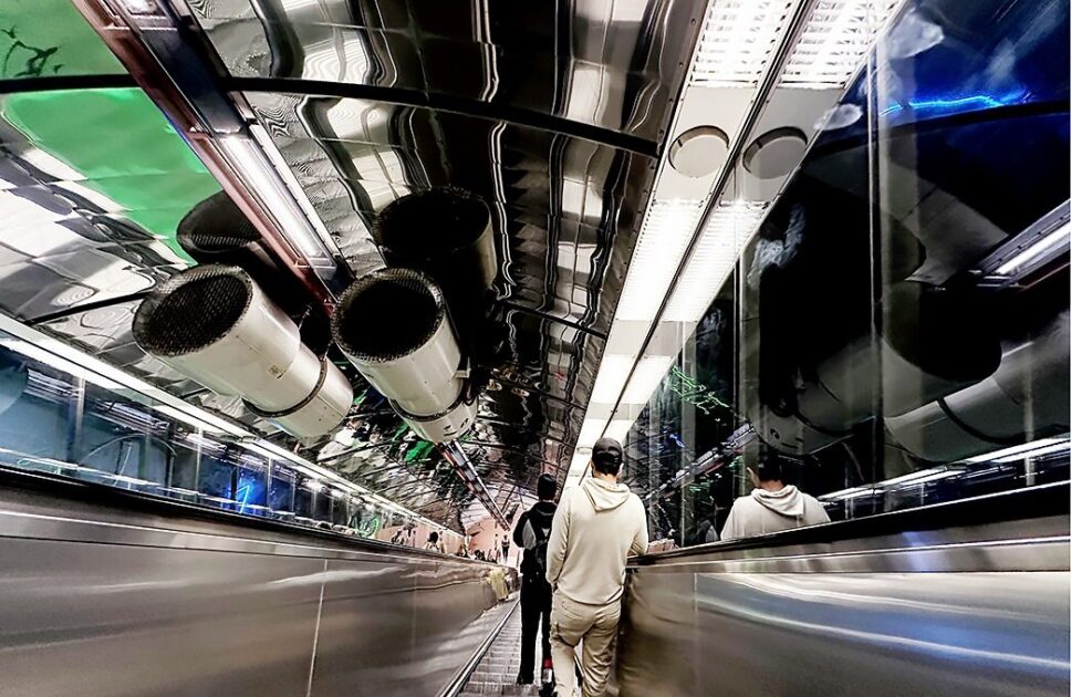 People on an escalator.